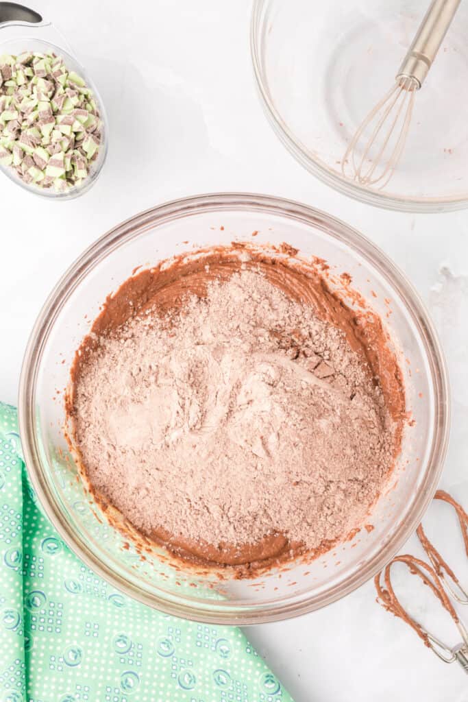 Chocolate donut batter partially mixed before adding Andes Mint Baking Chips