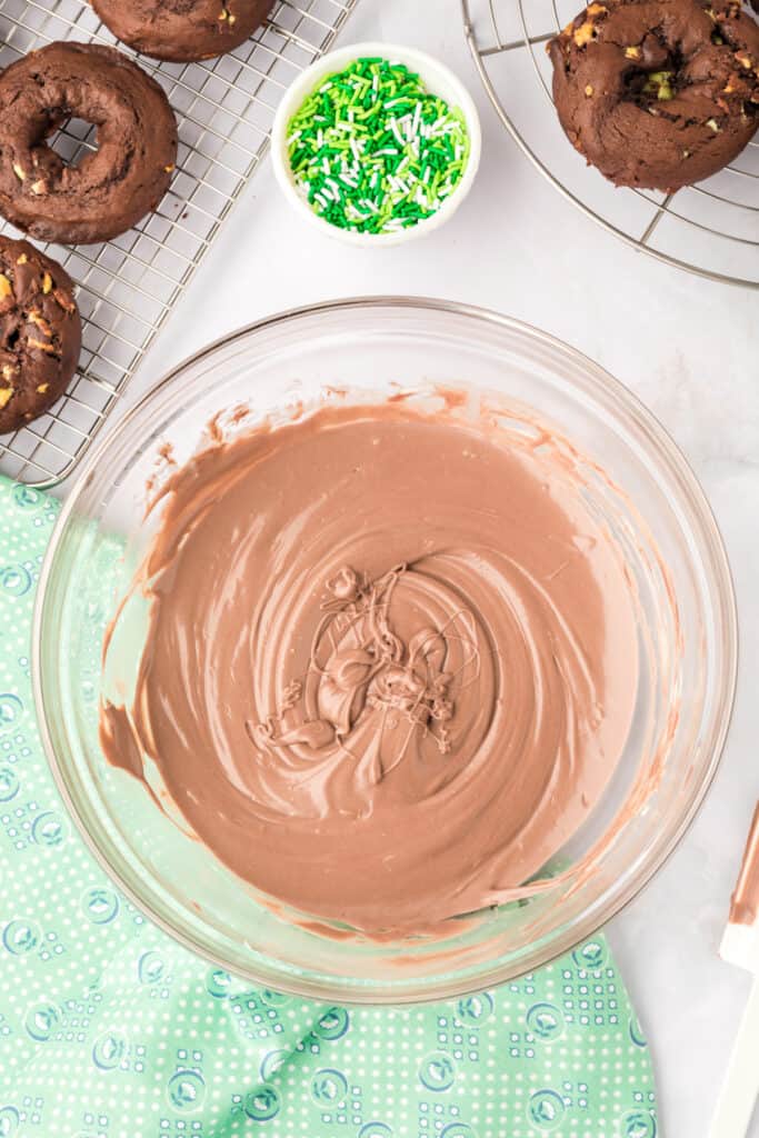 Smooth melted mint chocolate coating for dipping Chocolate Mint Donuts