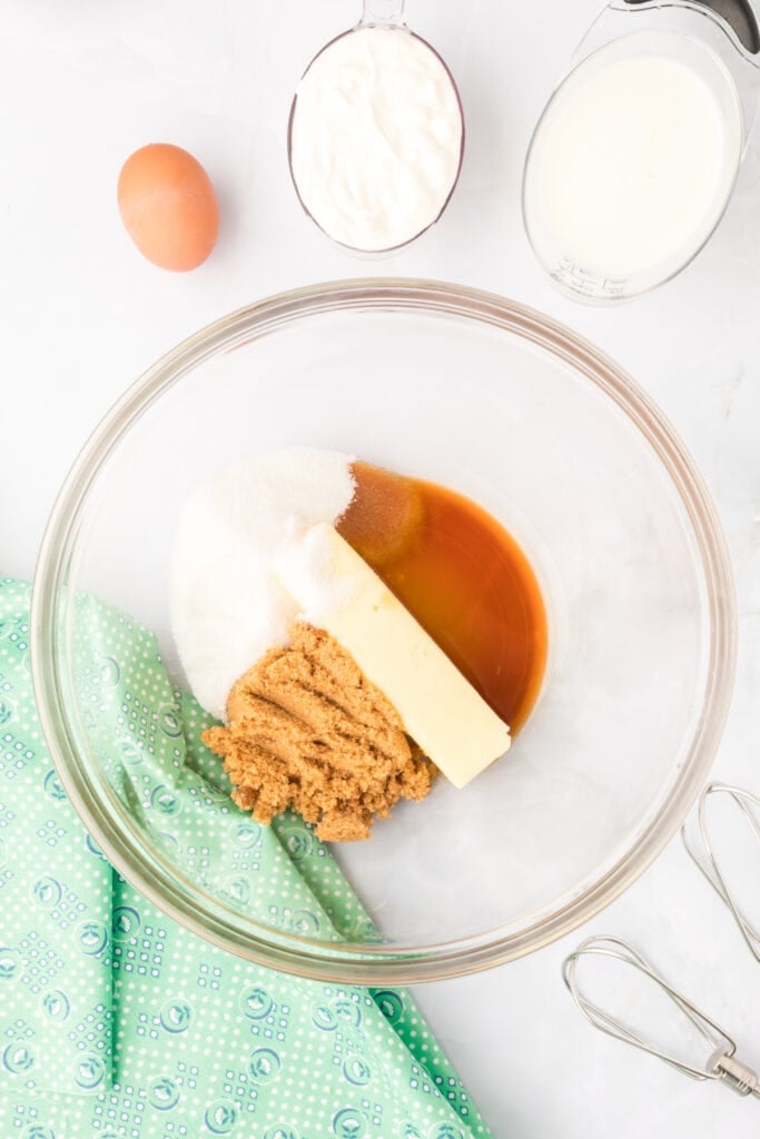 Butter, brown sugar, granulated sugar, and vanilla in a mixing bowl for Chocolate Mint Donuts