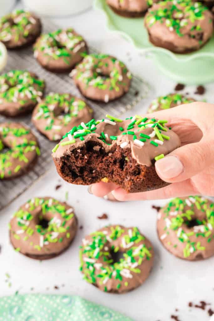 Bite taken from a Chocolate Mint Donut showing the soft, moist chocolate interior