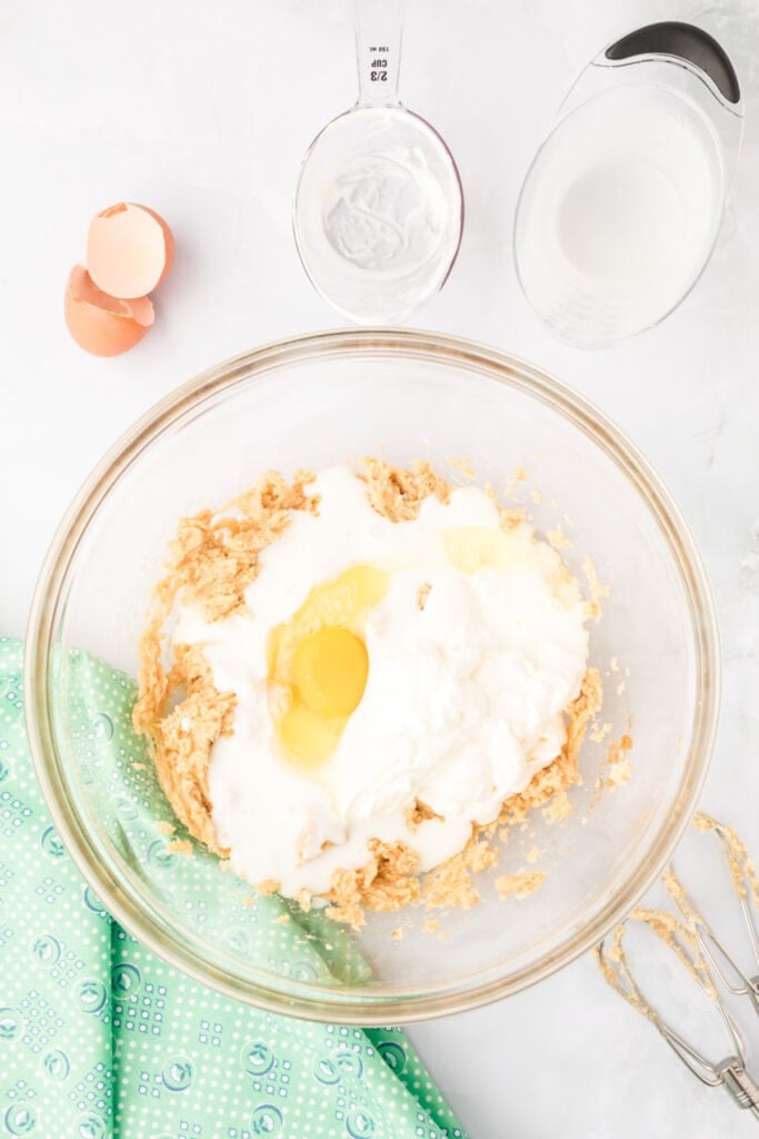 Egg, sour cream, and buttermilk added to the butter mixture for Chocolate Mint Donuts
