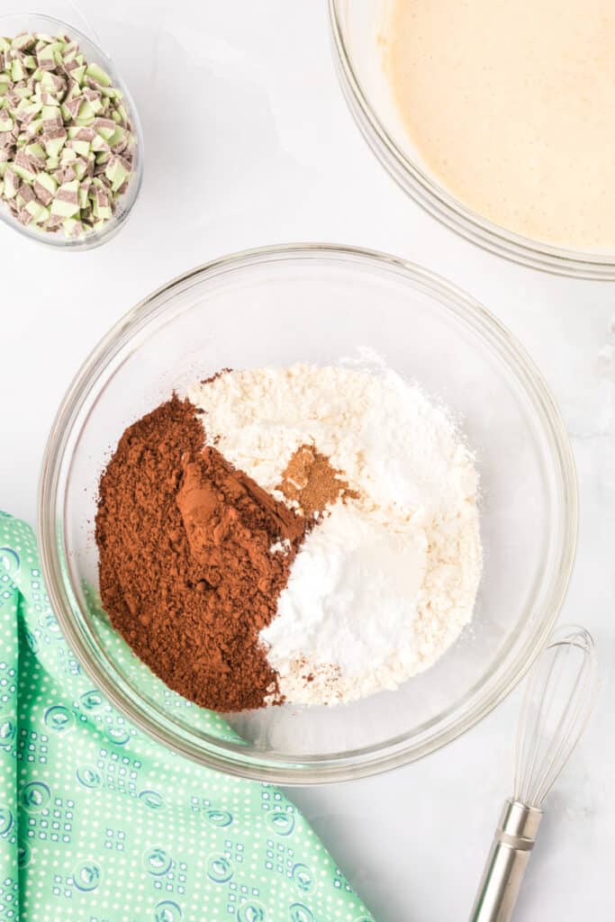 Flour, cocoa powder, baking powder, baking soda, and nutmeg combined for Chocolate Mint Donuts