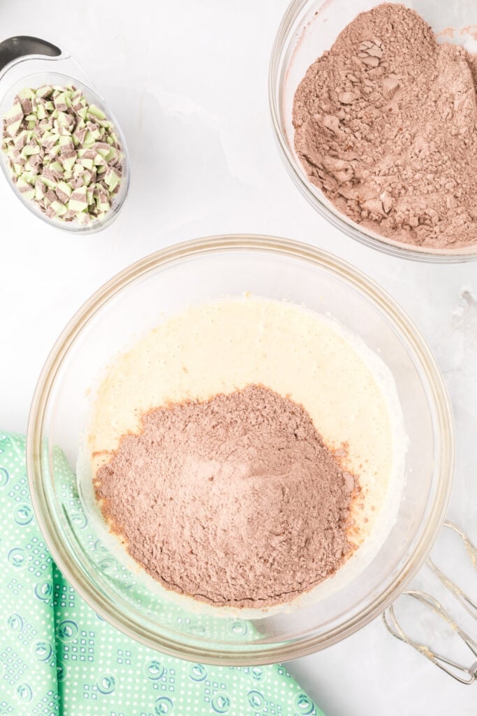 Dry ingredients being added to the wet ingredients for Chocolate Mint Donuts