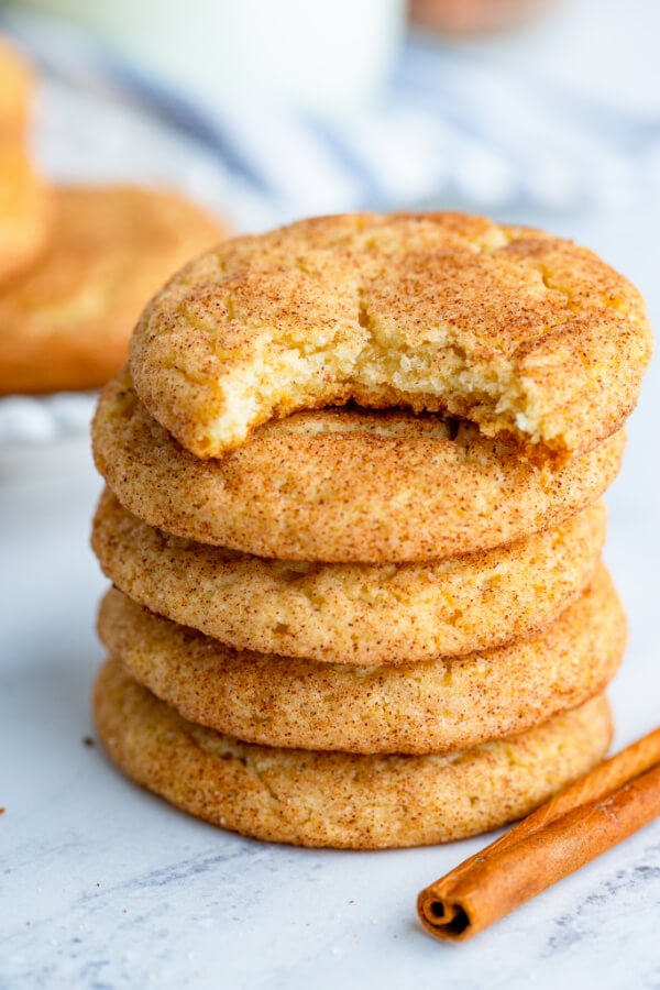 snickerdoodles cookies stacked the top one with a bite out of it