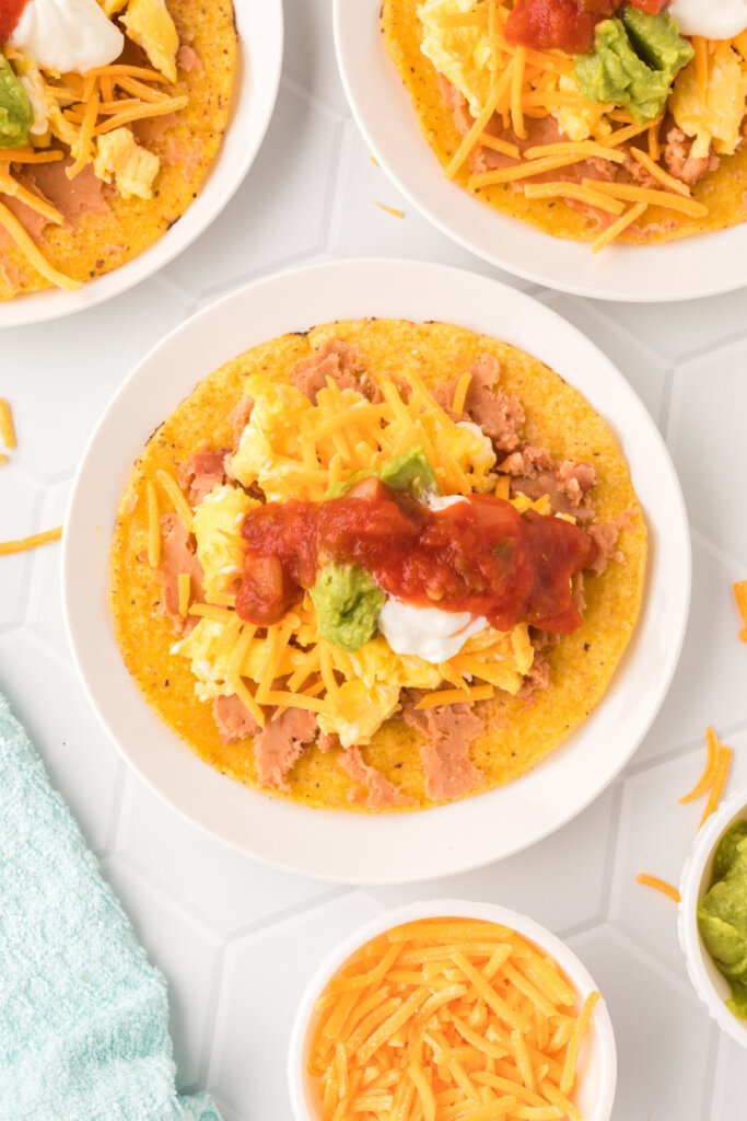 breakfast tostada on plate ready to eat