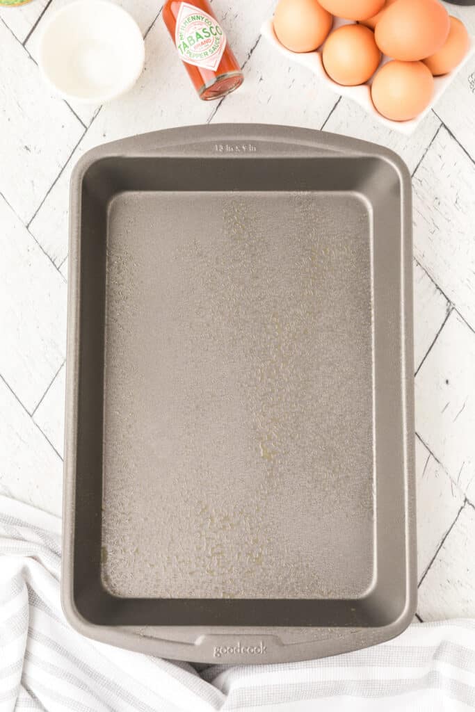 Greased 13x9-inch baking dish prepared for Chilies Rellenos Bake