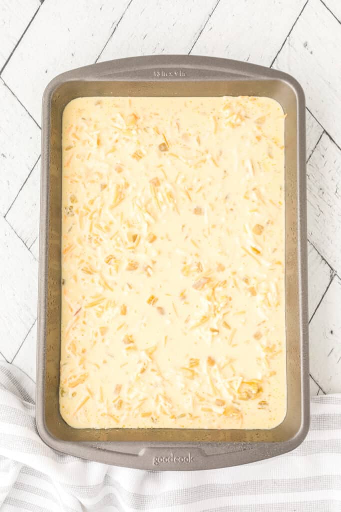 Unbaked Chilies Rellenos Bake mixture in a greased baking dish