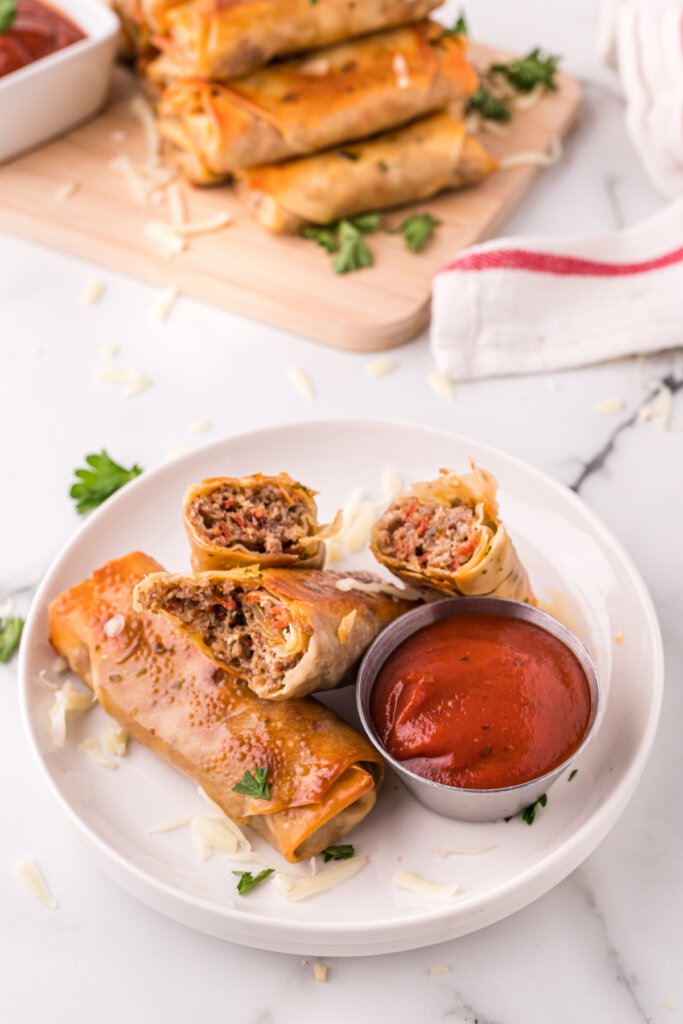 homemade pizza rolls with sauce on plate