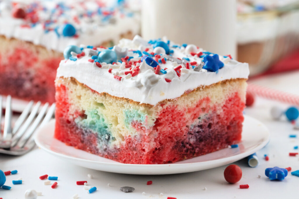 slice of patriotic jello poke cake on plate