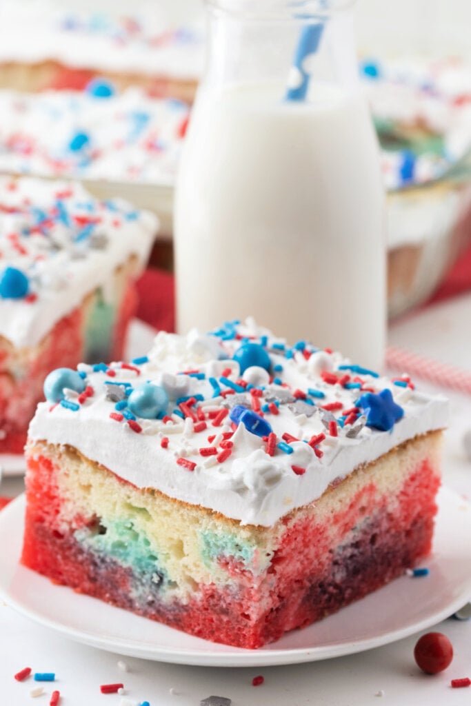 patriotic jello poke cake slice on plate