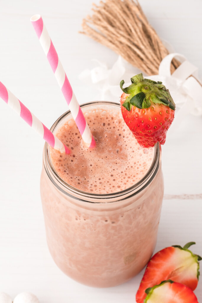 mason jar with chocolate covered strawberry smoothie