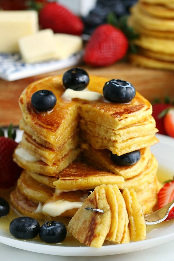 A stack of flapjacks with a piece removed to show the inside.