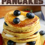stck of cornbread pancakes with blueberries and maple syrup