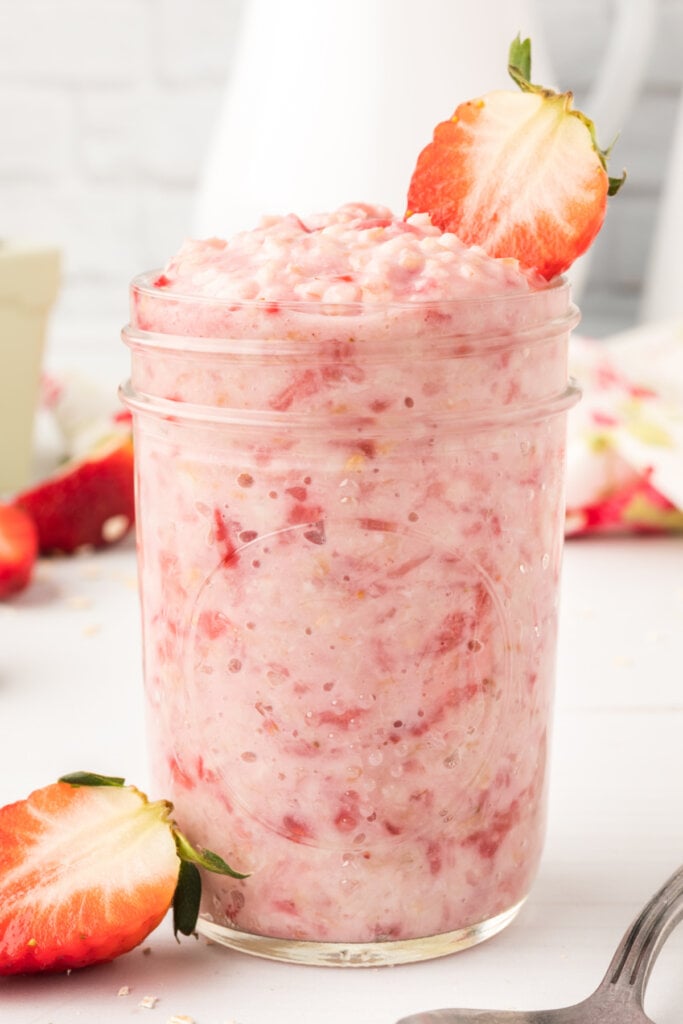 strawberries and cream oatmeal in glass mason jar