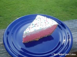 Sweet Tart Cheesecake Pie on blue plate.