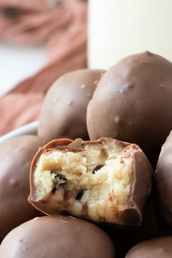 cookie dough truffle with a bite taken out of it