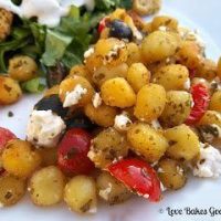 Crispy Pesto Gnocchi with Tomatoes, Black Olives and Feta Cheese