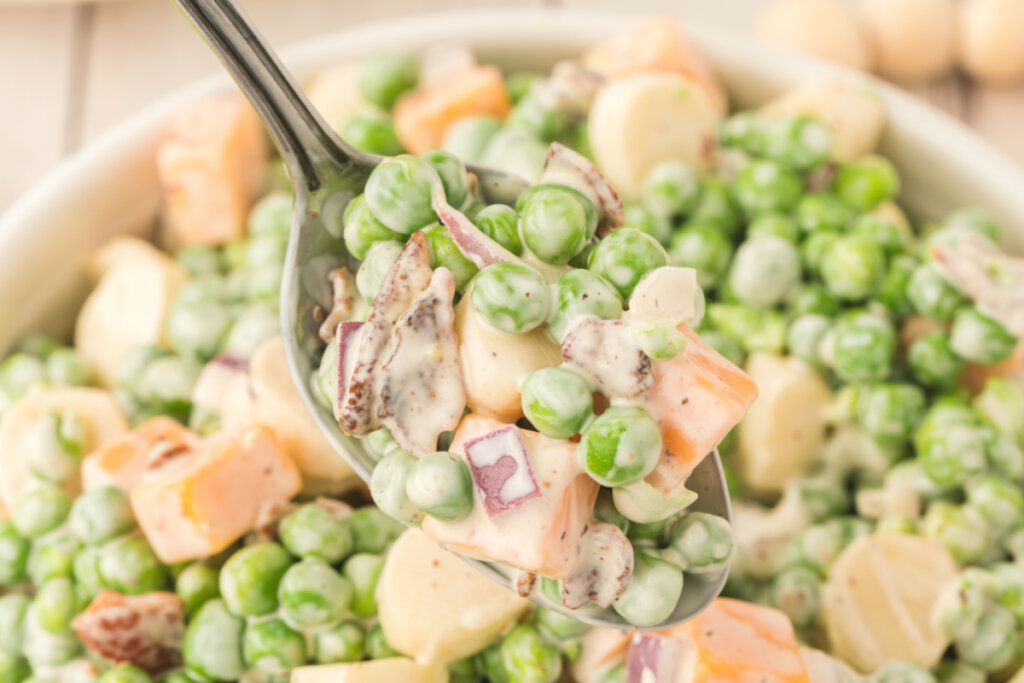 closeup of pea salad on spoon