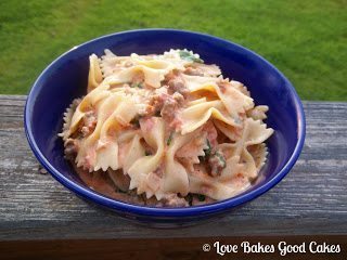 italian sausage with bow tie pasta, spinach and tomatoes