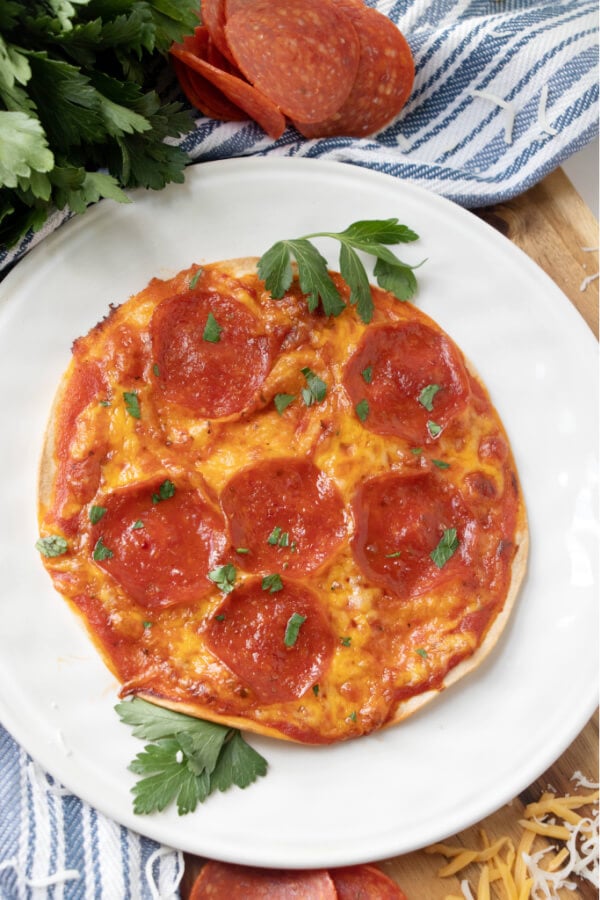 overhead shot of tortilla pizza on plate