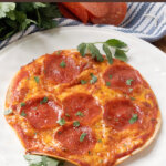 pepperoni tortilla pizza on plate