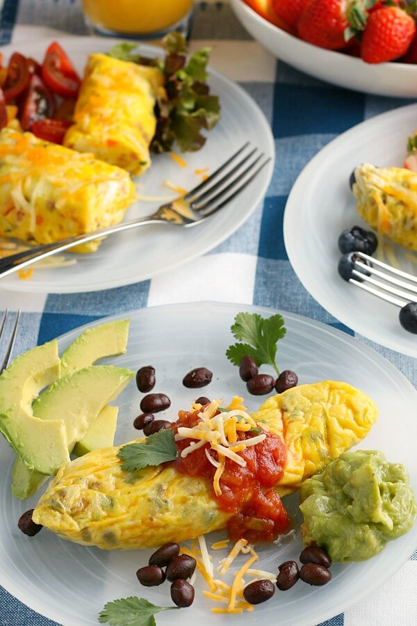 omelets on plates with garnish