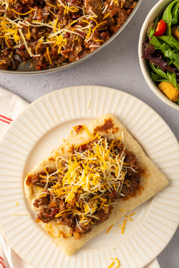 looking down onto a plate with a prepared flat bread melt