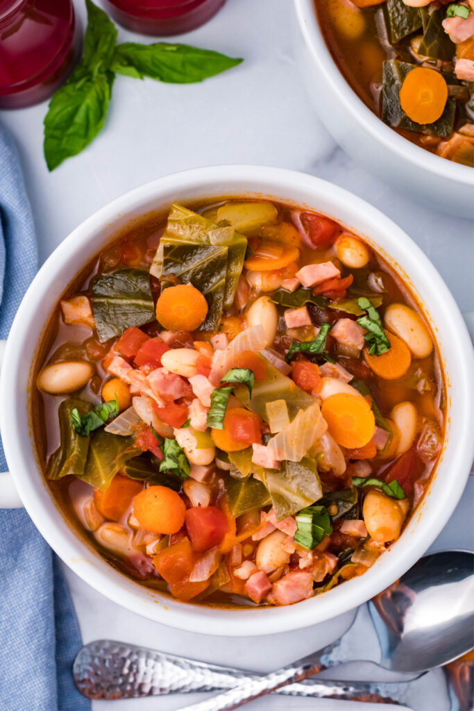 looking down into a bowl of ham bean cabbage soup