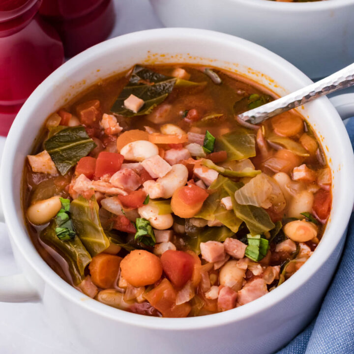 bowl of ham and bean soup with cabbage