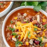 Taco Soup is a hearty and satisfying recipe with plenty of ground beef, beans, corn, and tomatoes in a zesty taco flavored broth.
