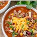 Taco Soup is a hearty and satisfying recipe with plenty of ground beef, beans, corn, and tomatoes in a zesty taco flavored broth.