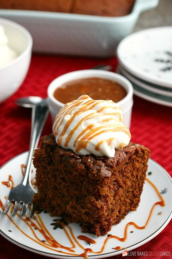 The sweet and spicy aroma of freshly baked Gingerbread will make your home smell like Christmas! This dense moist cake is a timeless classic! gingerbread on a plate with a fork