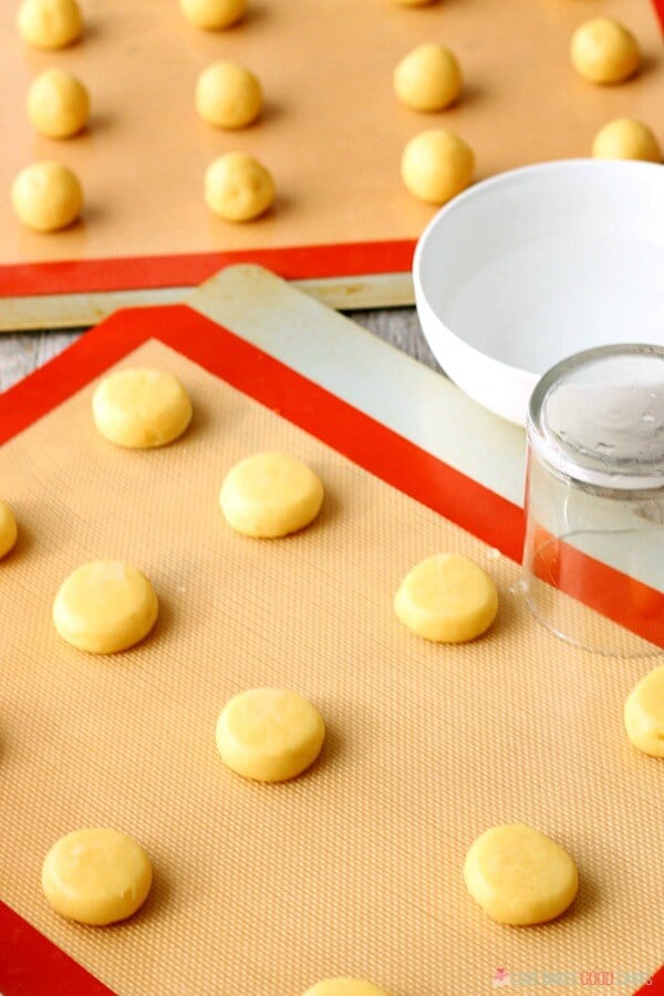 Soft Sugar Cookie dough being put on cookie sheets.