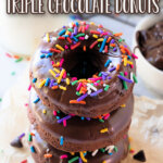 three chocolate donuts stacked