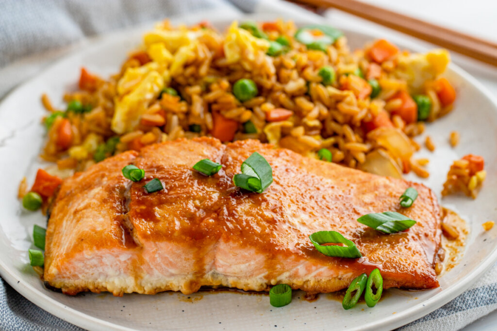 asian salmon with fried rice on plate