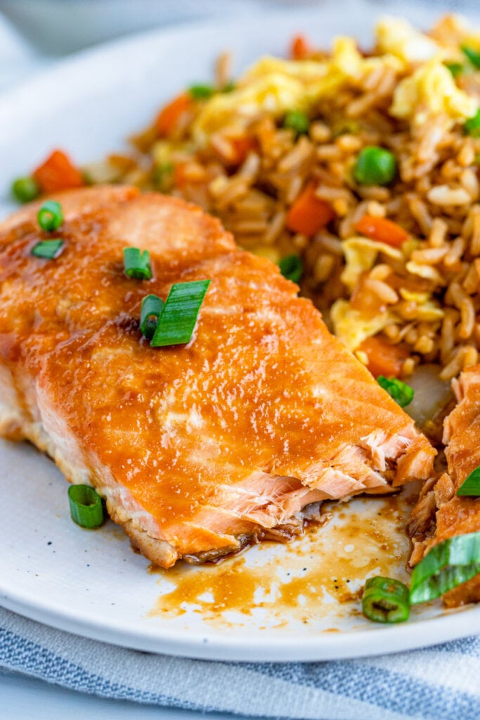 asian baked salmon on plate with fried rice