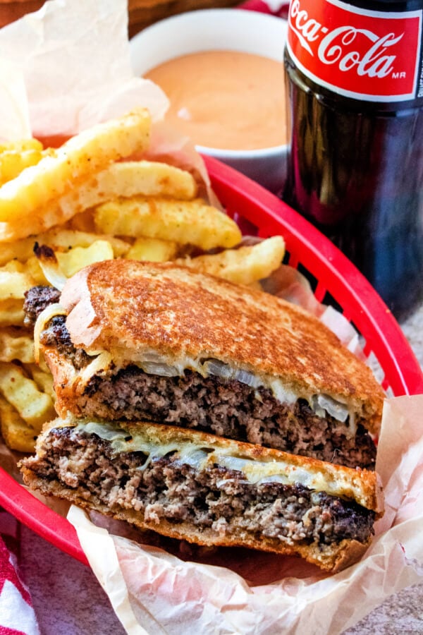 red basket with sandwich and fries