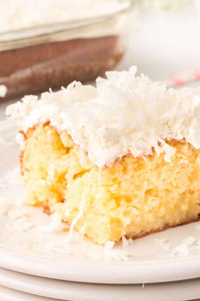 slice of coconut cream poke cake on plate