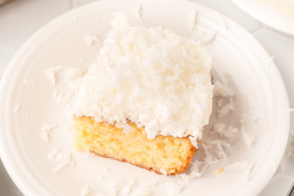 slice of coconut cream poke cake on plate