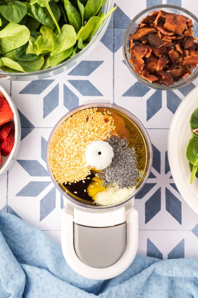 ingredients for balsamic poppy seed dressing in a food processor before blending