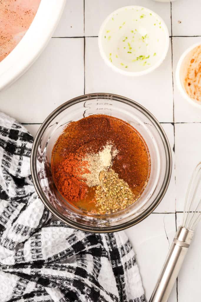 Chipotle lime sauce ingredients combined in a glass bowl before mixing