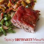 spicy southwest meatloaf on white plate with green beans and potatoes