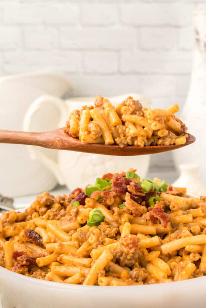spoonful of BBQ Beefy Mac and Cheese showing ground beef and creamy cheese sauce