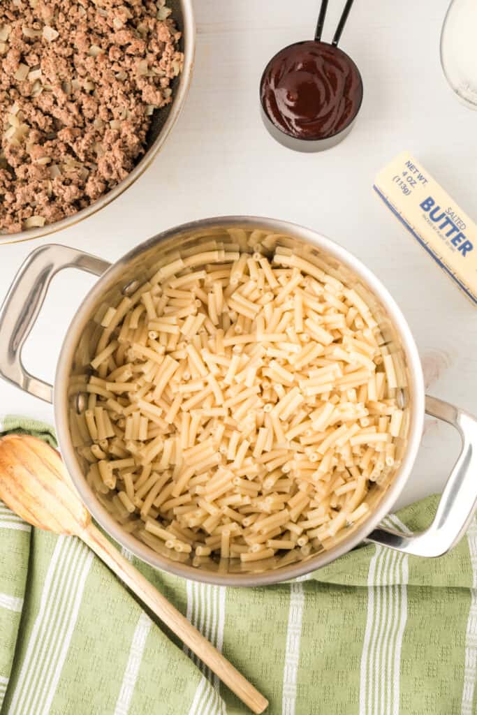 cooked elbow macaroni in a pot for BBQ Beefy Mac and Cheese