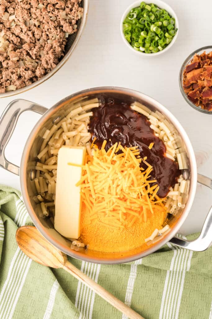 macaroni with butter, cheese, and BBQ sauce added for BBQ Beefy Mac and Cheese