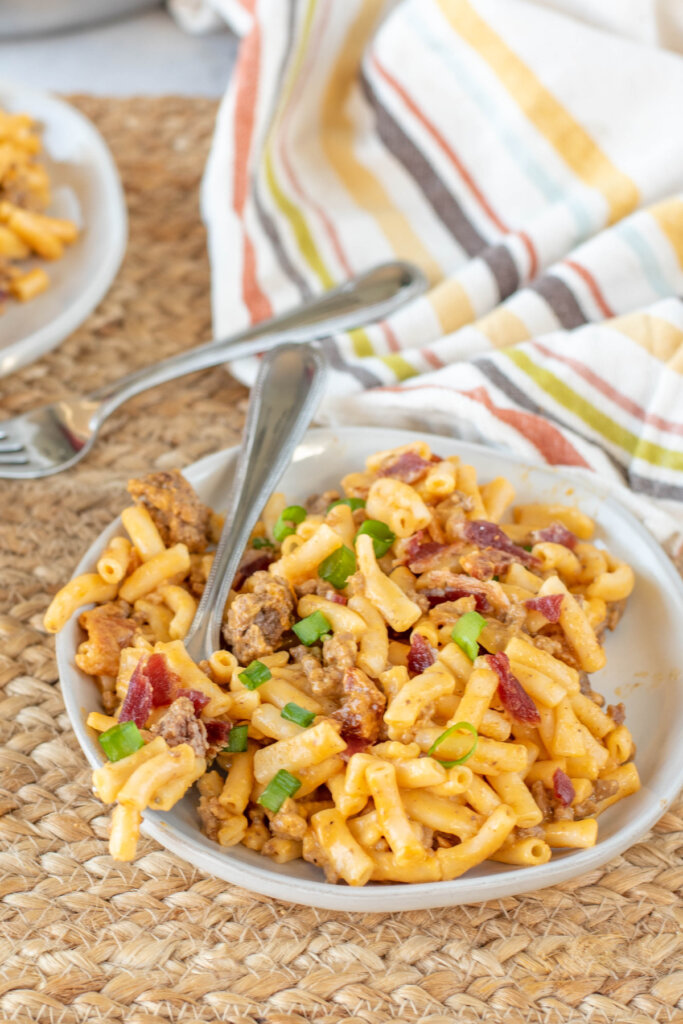 fork in a bowl of beefy bbq mac and cheese