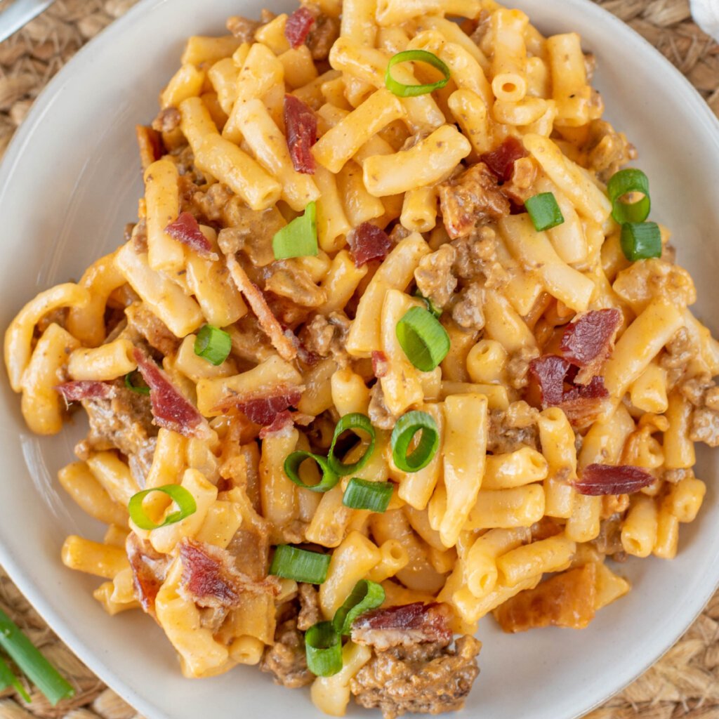 closeup looking down into bowl with beefy bbq mac and cheese