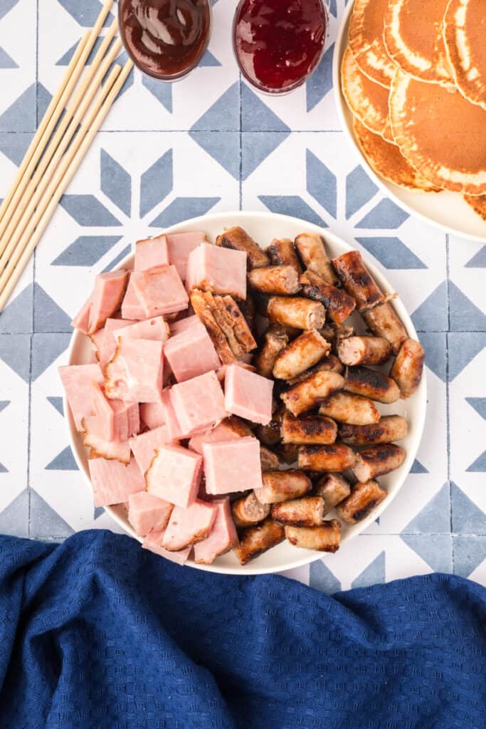 Chopped ham and sliced breakfast sausage for Breakfast Kabobs and Mini Pancakes