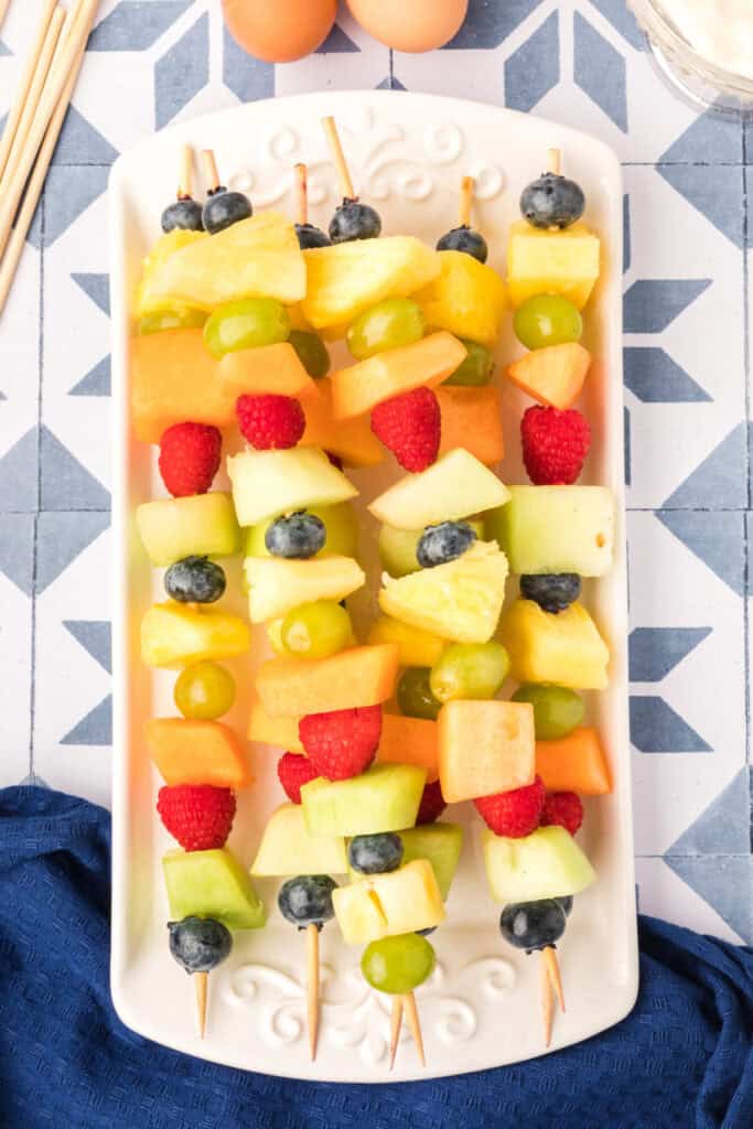 Fresh fruit breakfast kabobs arranged on platter for Breakfast Kabobs and Mini Pancakes