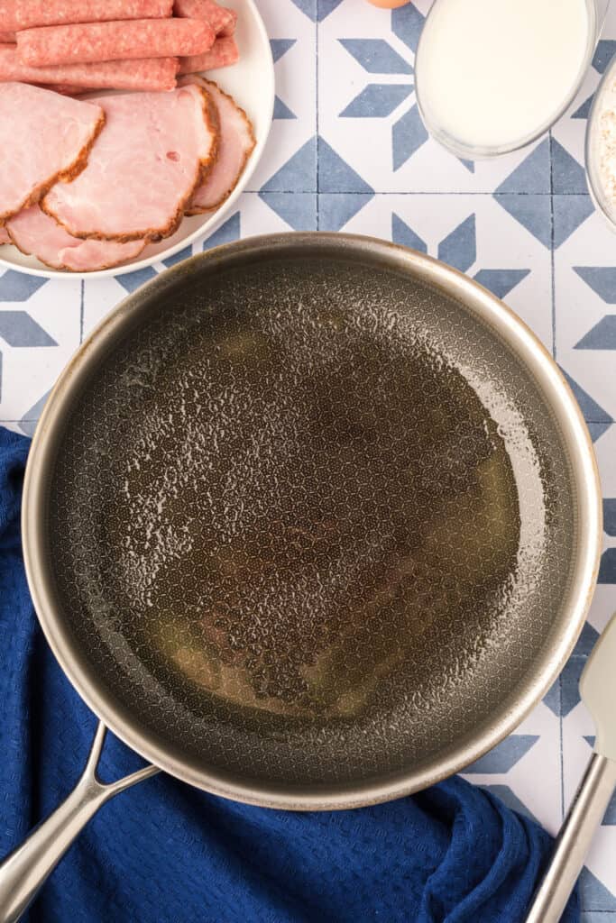 Greased skillet prepared for cooking mini pancakes for Breakfast Kabobs and Mini Pancakes